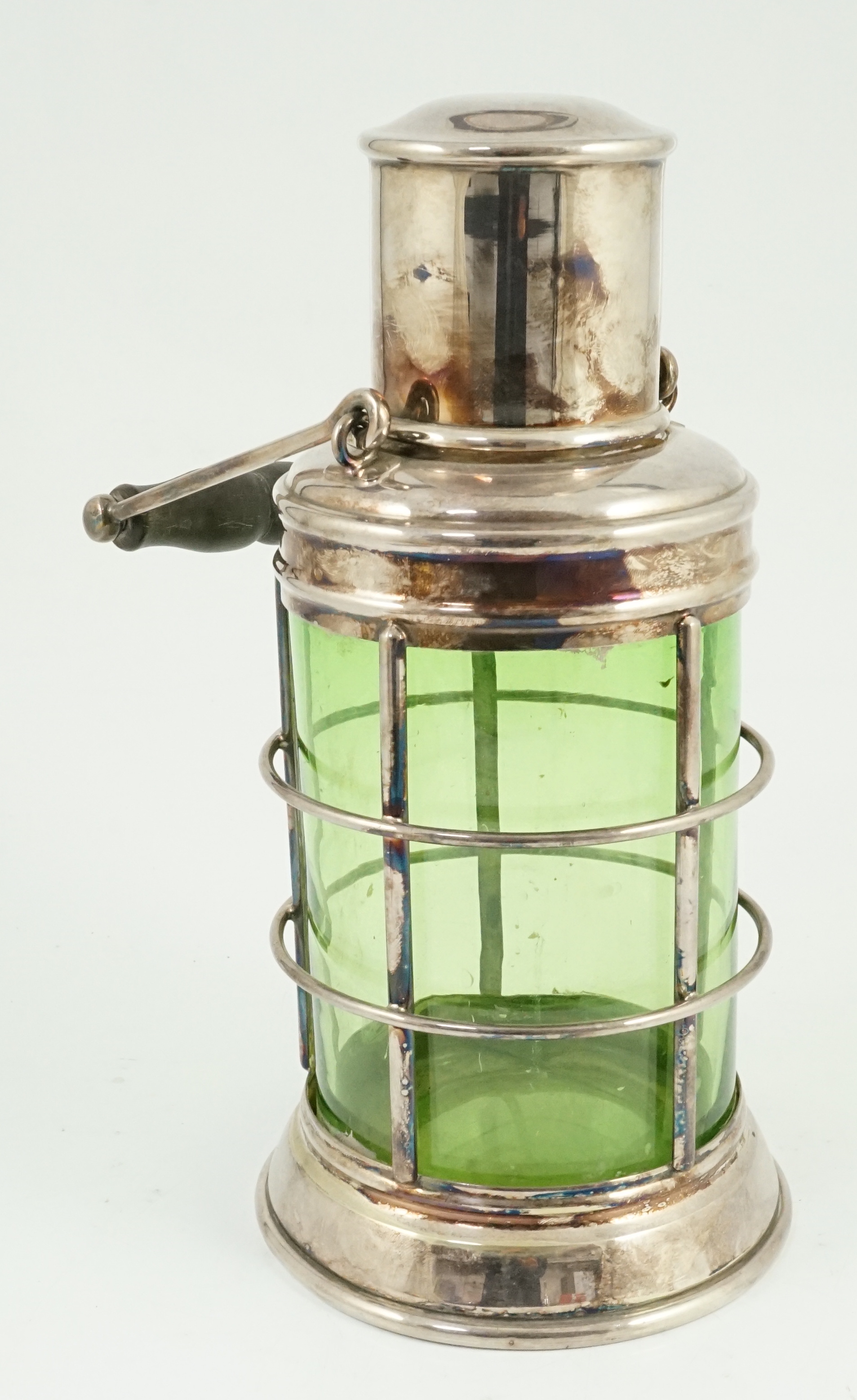 An Asprey & Co. silver plated and green glass novelty cocktail shaker in the form of a lantern